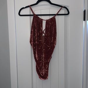 Pink velour bodysuit